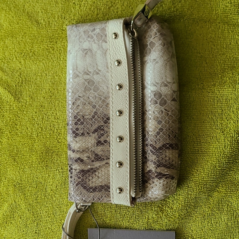 Women's clutch purse with multiple pockets.  Snake skin taupe and cream print.